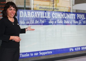 ASB Bank�s Serena Carran shows off the new pool donations board